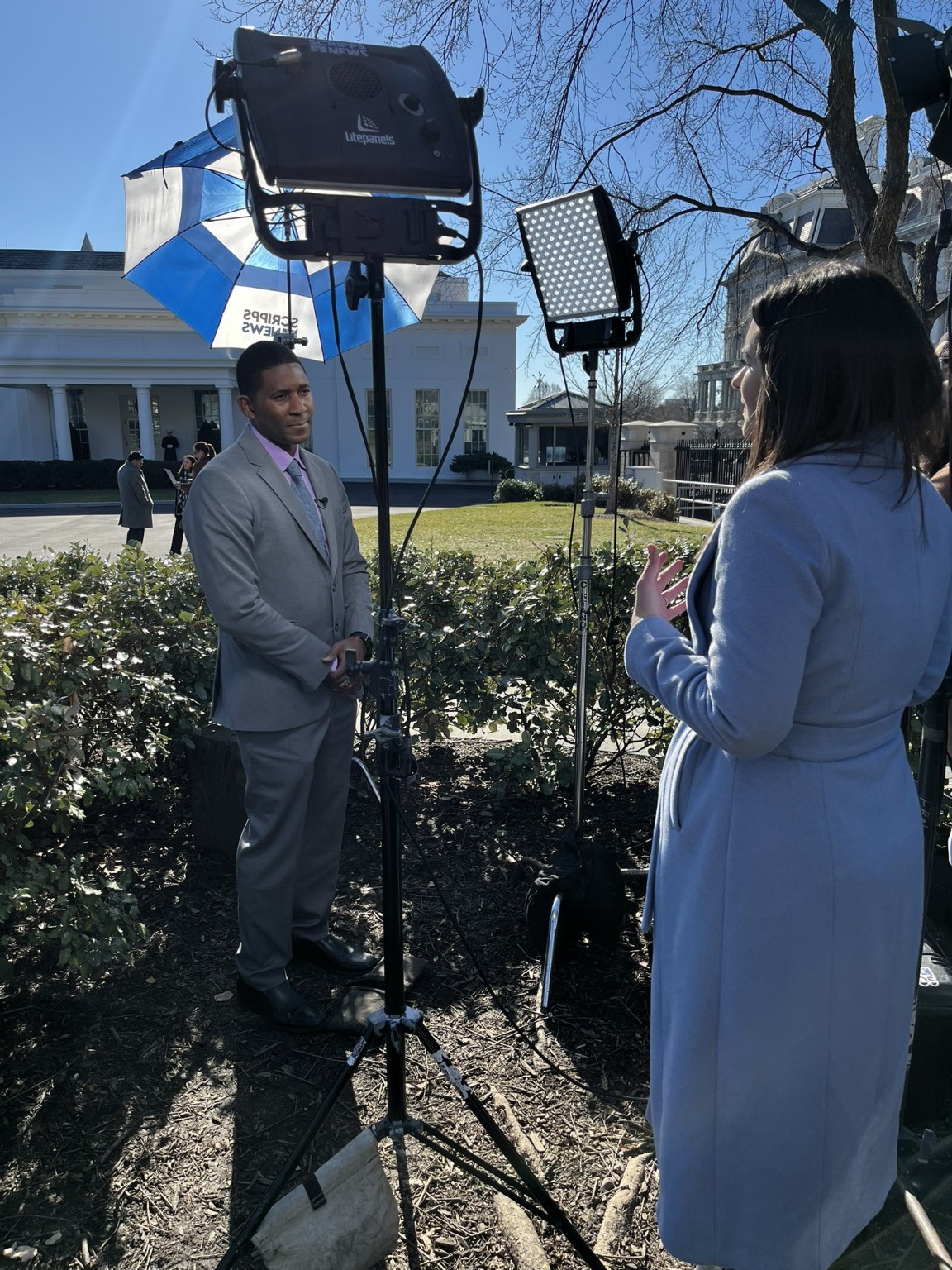 C. Kirabo Jackson being interviewed by a reporter outside the White House