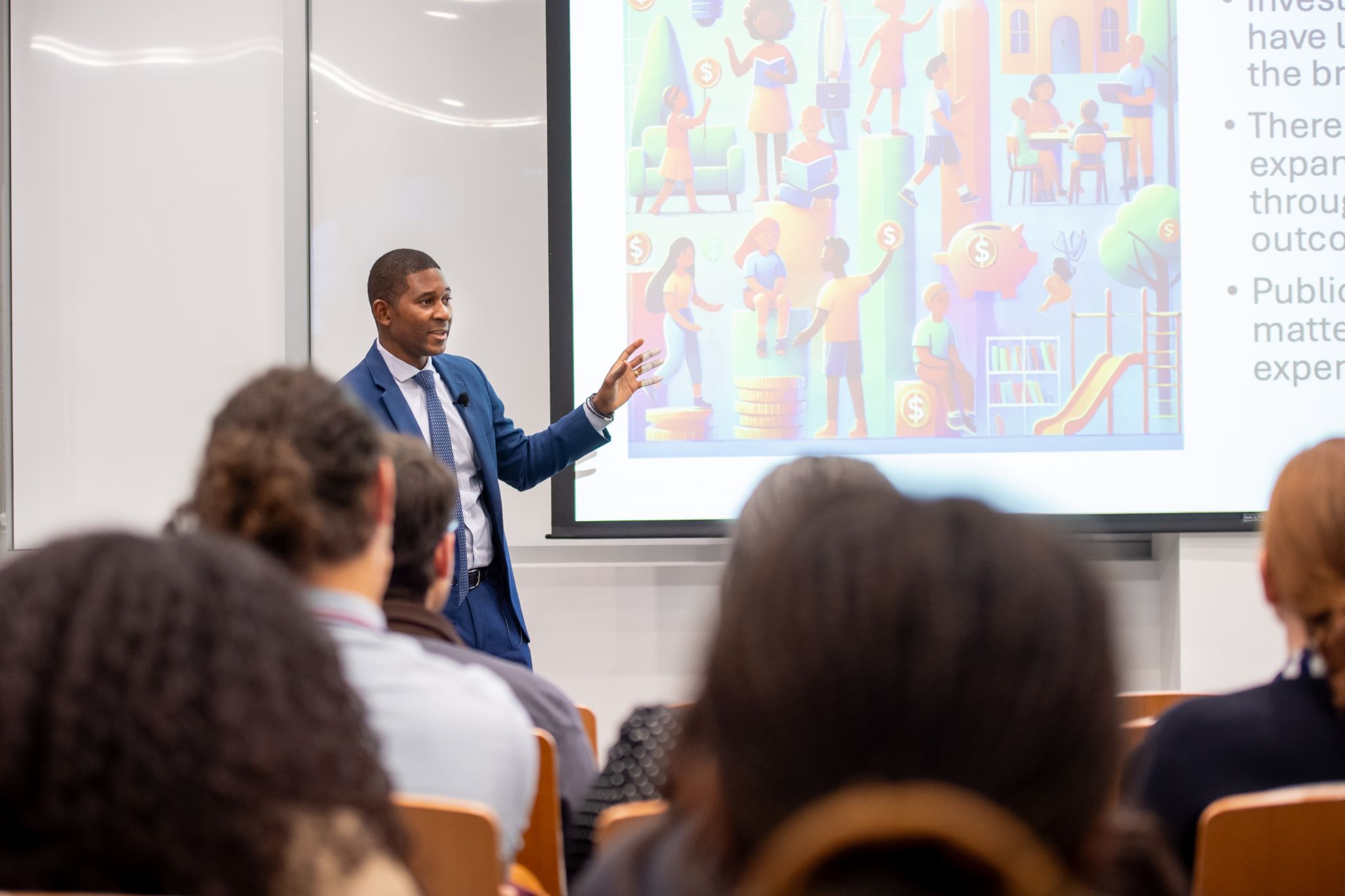 C. Kirabo Jackson presenting research to an audience